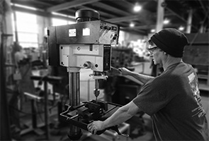 Worker using drilling machine