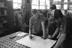 Employees meeting over machine plans